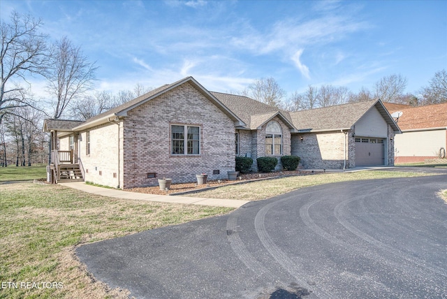 ranch-style home featuring driveway, a garage, a shingled roof, crawl space, and brick siding