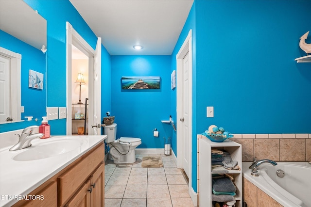 full bathroom featuring toilet, tile patterned floors, a garden tub, and vanity