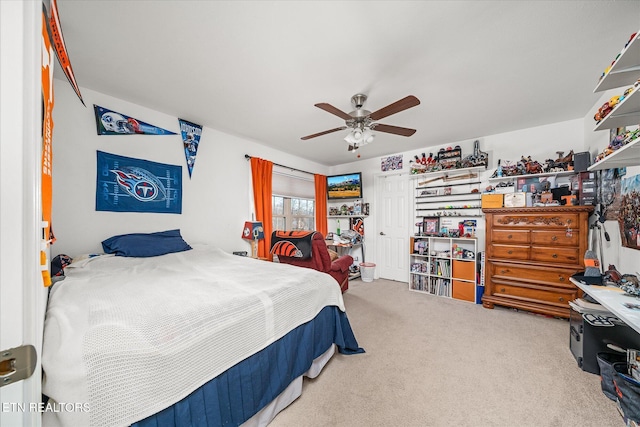 carpeted bedroom with ceiling fan