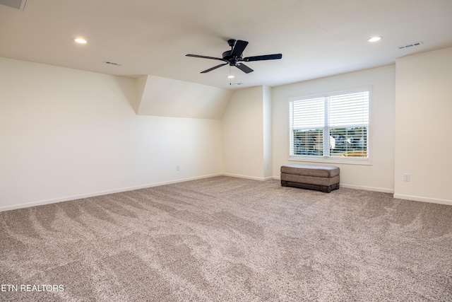 bonus room featuring ceiling fan, carpet, and lofted ceiling