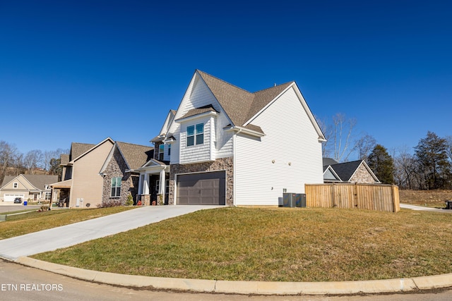 view of front of house with a garage and a front yard