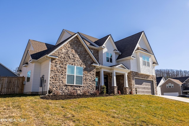 craftsman-style home featuring a garage and a front lawn