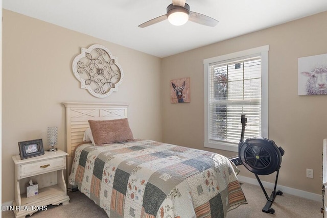 bedroom with light carpet and ceiling fan