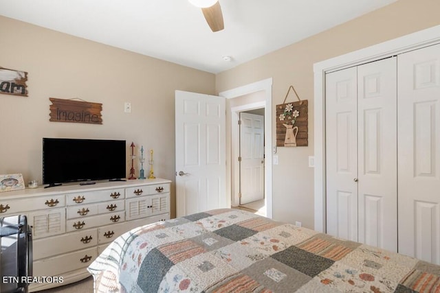 bedroom with ceiling fan and a closet