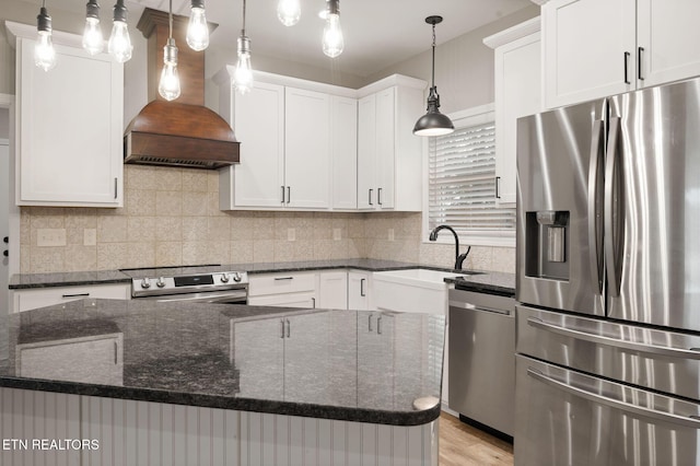 kitchen with premium range hood, white cabinetry, a center island, and stainless steel appliances