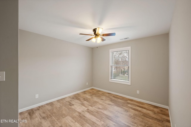 unfurnished room featuring ceiling fan and light hardwood / wood-style flooring