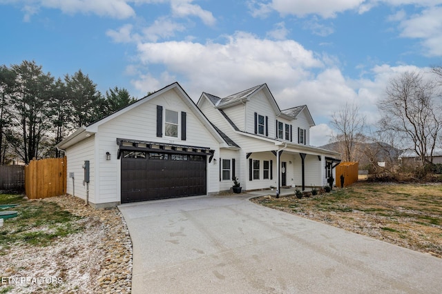 view of front of property with a porch and a garage