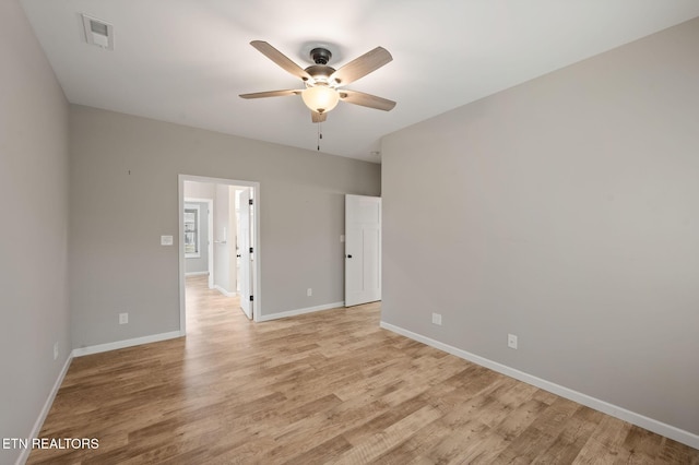 empty room featuring light wood-type flooring and ceiling fan