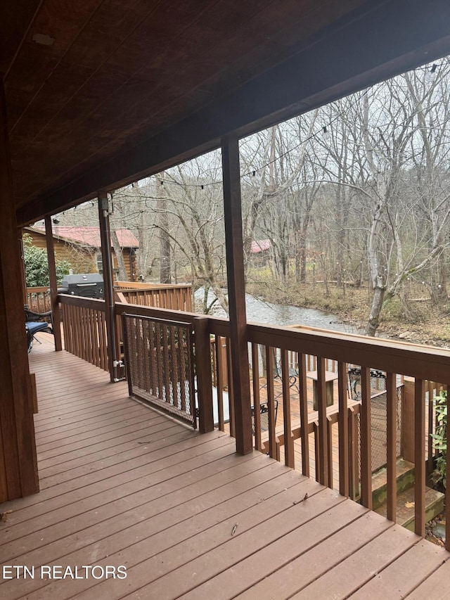 deck featuring a water view