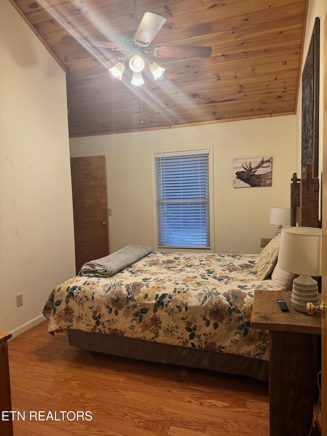 bedroom with lofted ceiling, hardwood / wood-style floors, wooden ceiling, and ceiling fan