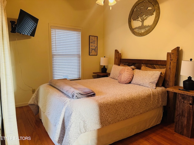 bedroom featuring dark hardwood / wood-style flooring