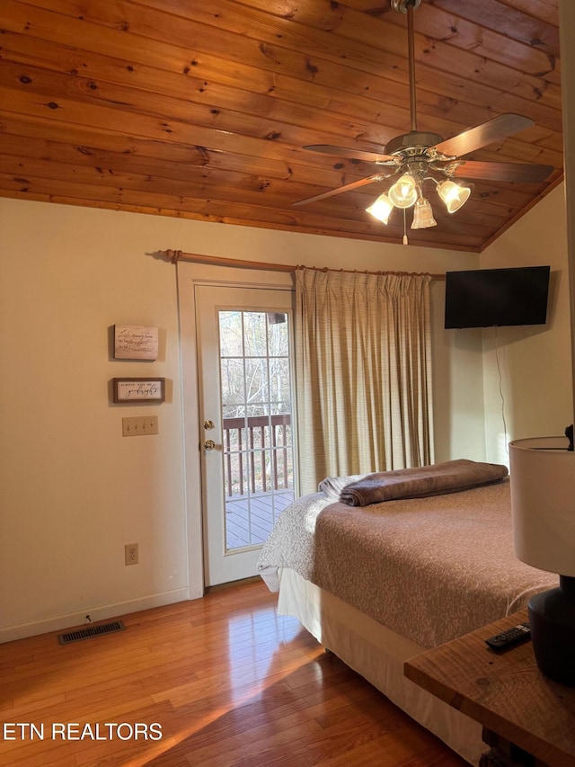 bedroom with vaulted ceiling, hardwood / wood-style floors, access to outside, wood ceiling, and ceiling fan