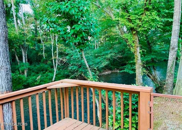 deck featuring a water view