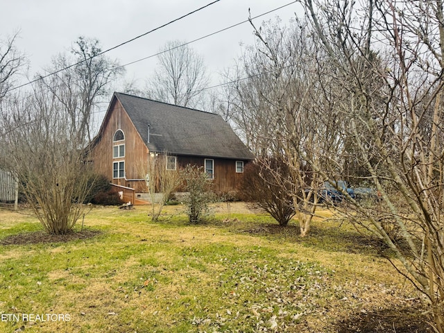 view of home's exterior with a yard