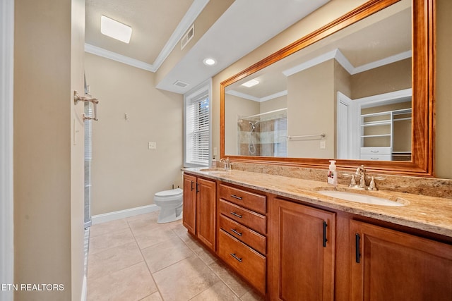 bathroom with toilet, vanity, tile patterned floors, crown molding, and an enclosed shower