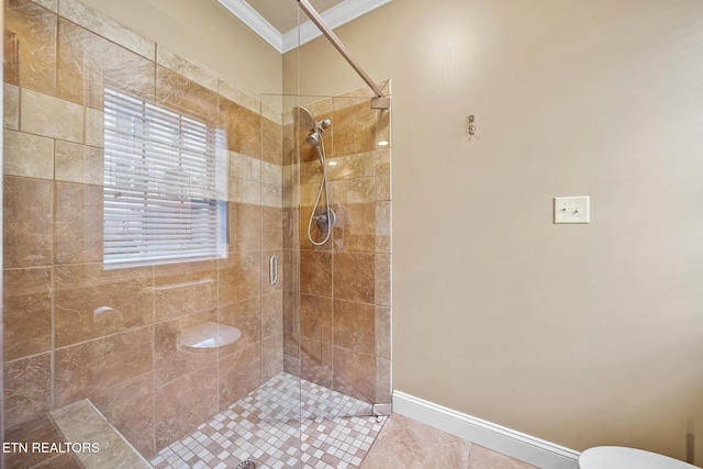 bathroom with ornamental molding, tile patterned floors, and a shower with door