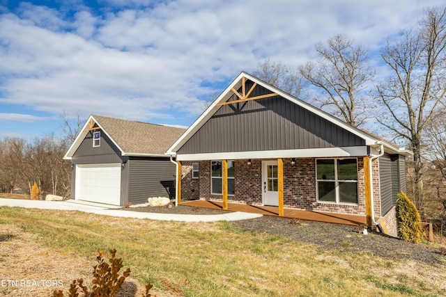 craftsman-style house with a garage, a porch, and a front lawn