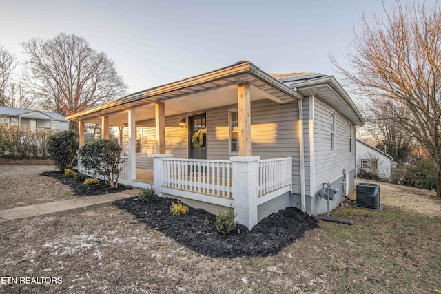 view of front of property featuring a porch and central AC