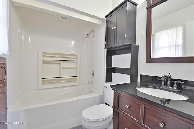 bathroom featuring vanity,  shower combination, and toilet