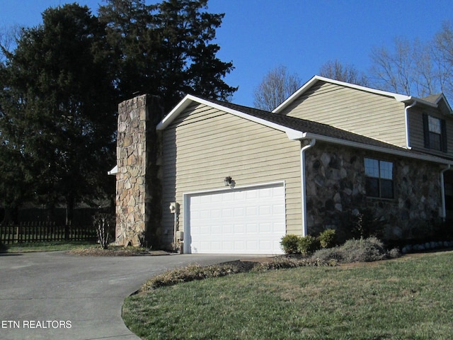 view of home's exterior with a yard and a garage