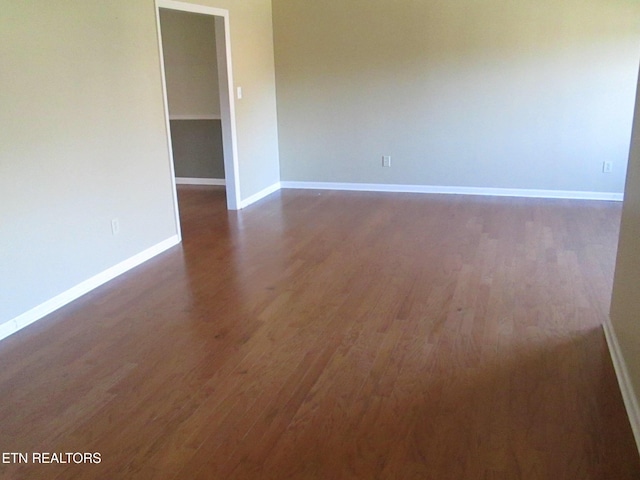 empty room featuring dark hardwood / wood-style floors