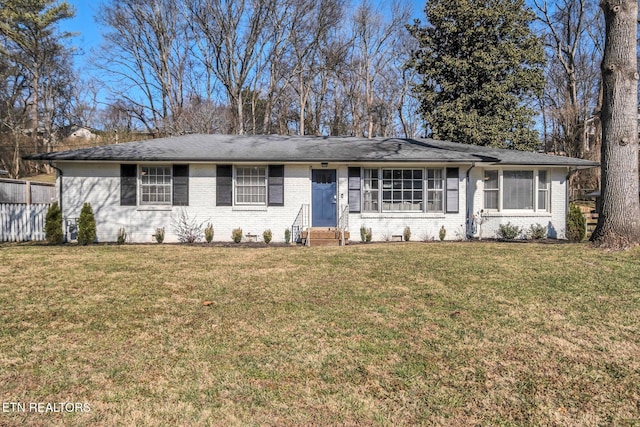 single story home featuring a front lawn