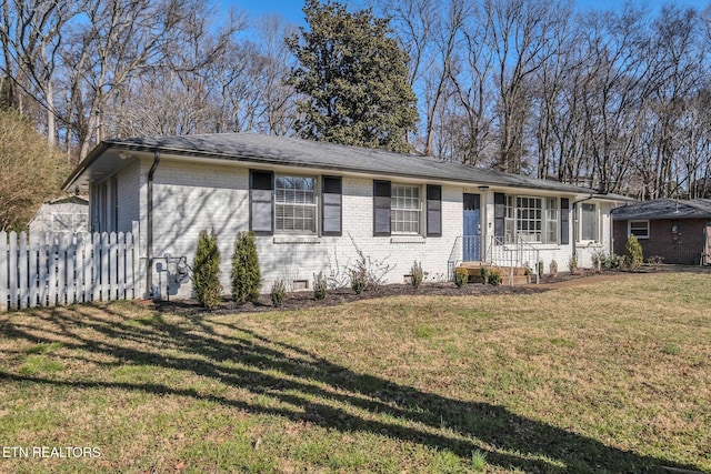 ranch-style home with a front lawn