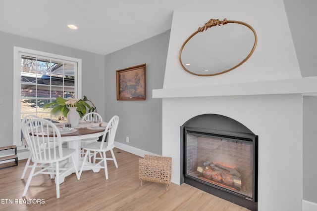 dining space with light hardwood / wood-style floors