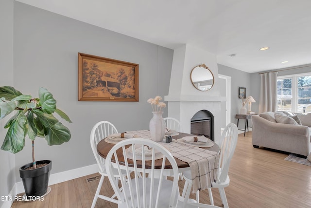 dining space with light wood-type flooring