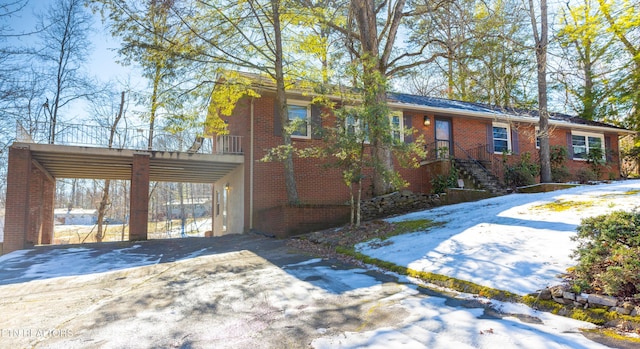 view of front of home featuring a carport