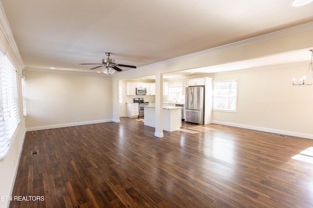 unfurnished living room with crown molding, ceiling fan with notable chandelier, and dark hardwood / wood-style floors