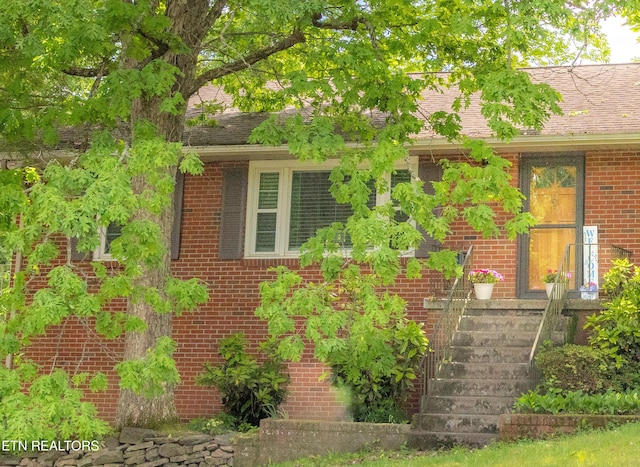 view of property exterior with brick siding