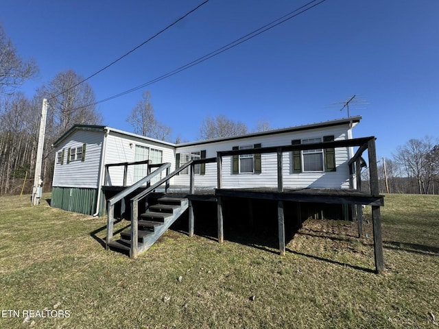 exterior space featuring a front lawn and a deck