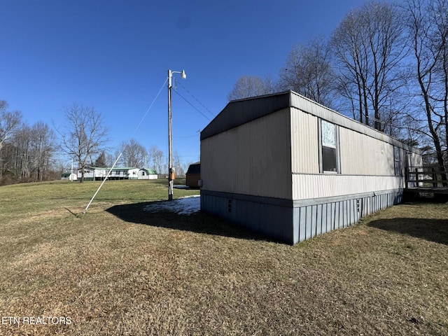 view of home's exterior featuring a lawn