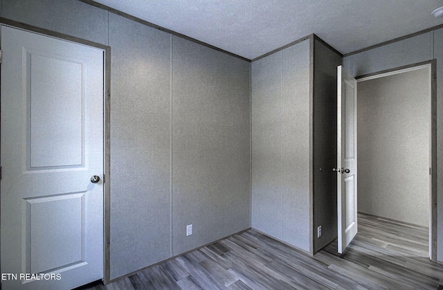 unfurnished bedroom featuring a closet and light wood-type flooring