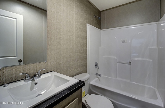 full bathroom featuring toilet, vanity, and shower / bathing tub combination