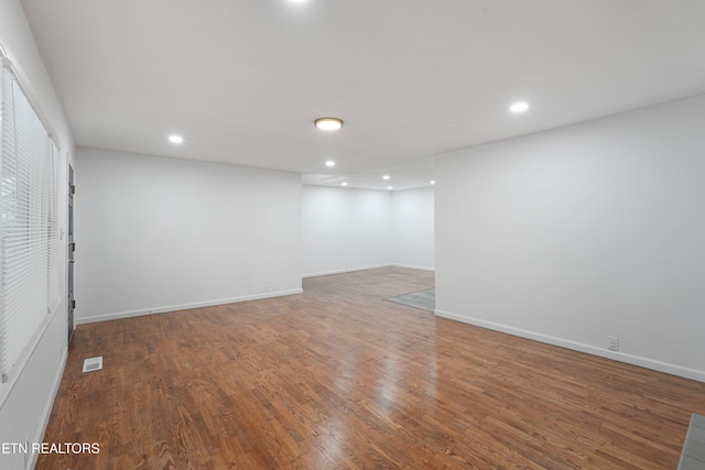 spare room with hardwood / wood-style flooring