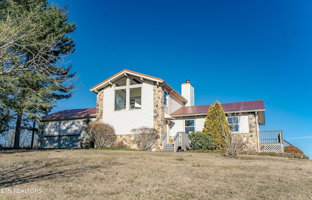 back of property featuring a lawn