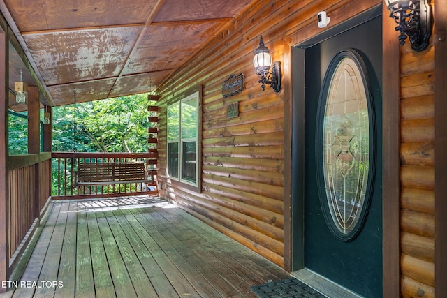 entrance to property with covered porch