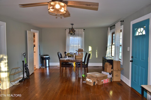 dining area featuring ceiling fan and dark hardwood / wood-style flooring