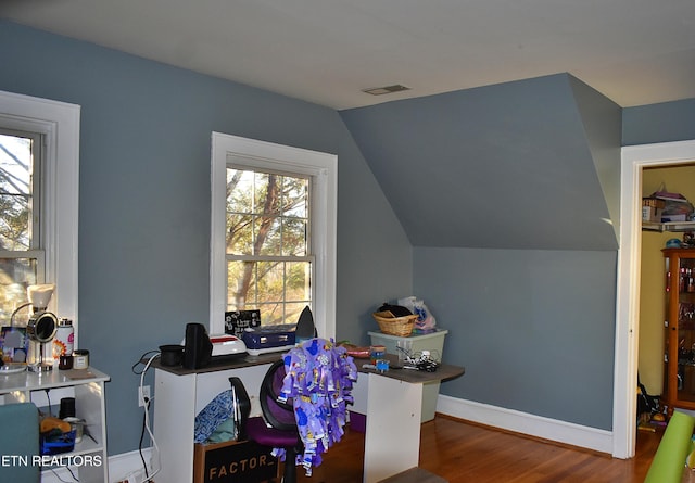 home office featuring hardwood / wood-style flooring and lofted ceiling