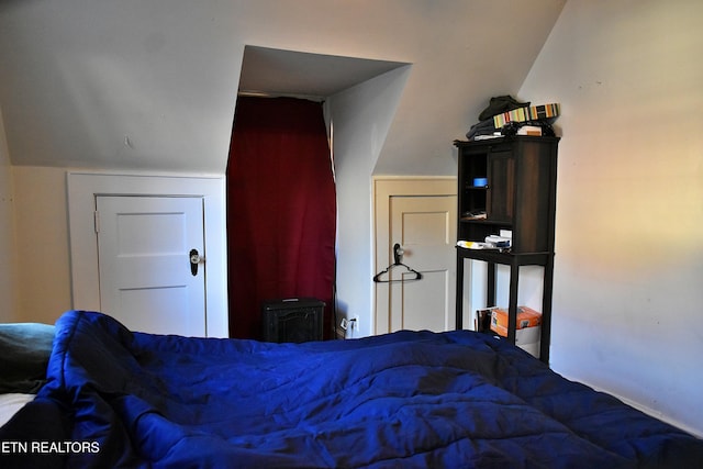 bedroom featuring vaulted ceiling