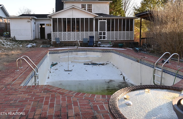 view of pool with a sunroom