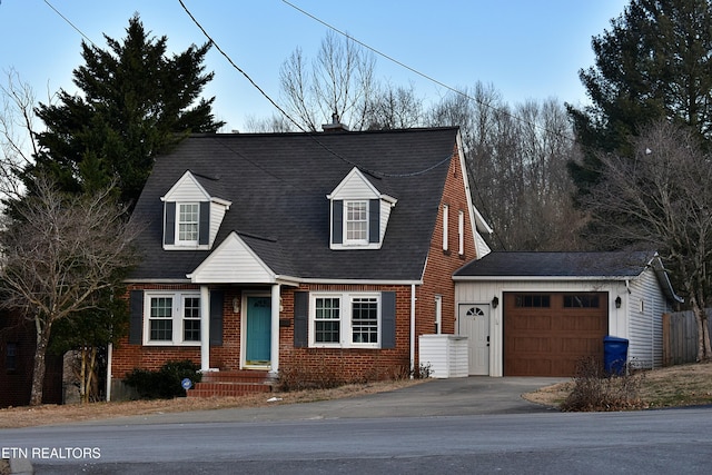 new england style home with a garage