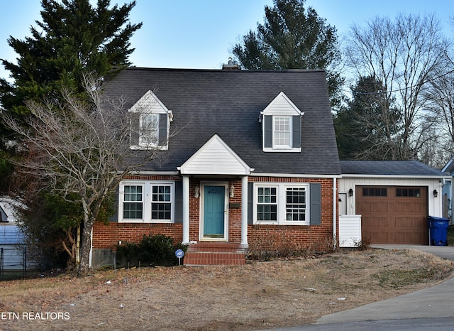 new england style home with a garage