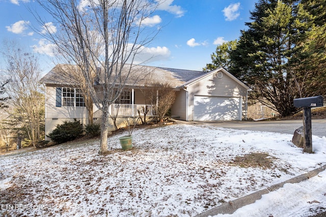 single story home with a garage and covered porch