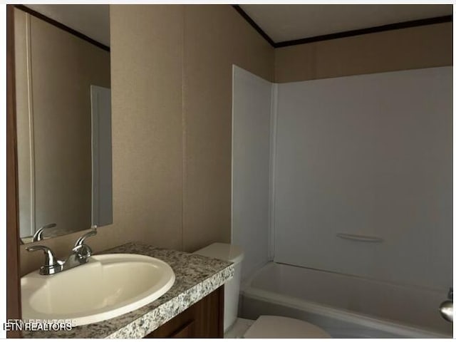 full bathroom featuring toilet, shower / tub combination, and vanity