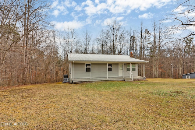 view of front of property with a porch and a front yard