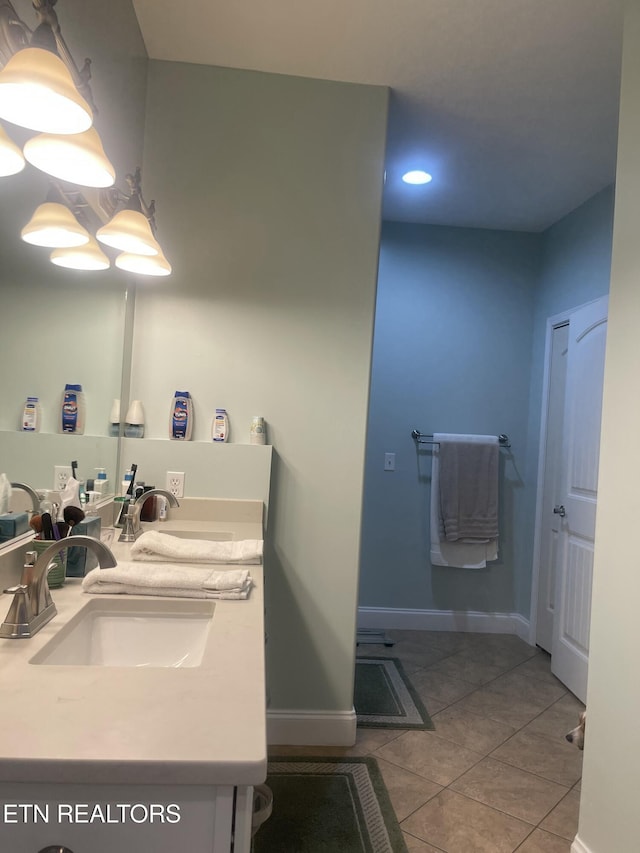 bathroom with vanity and tile patterned flooring