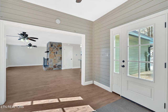 entryway with ceiling fan and hardwood / wood-style flooring